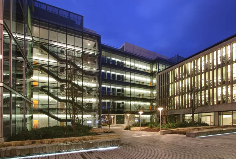 Exterior evening view of a seven-story laboratory facility at UW Medicine's Lake Union campus (Phase 2)