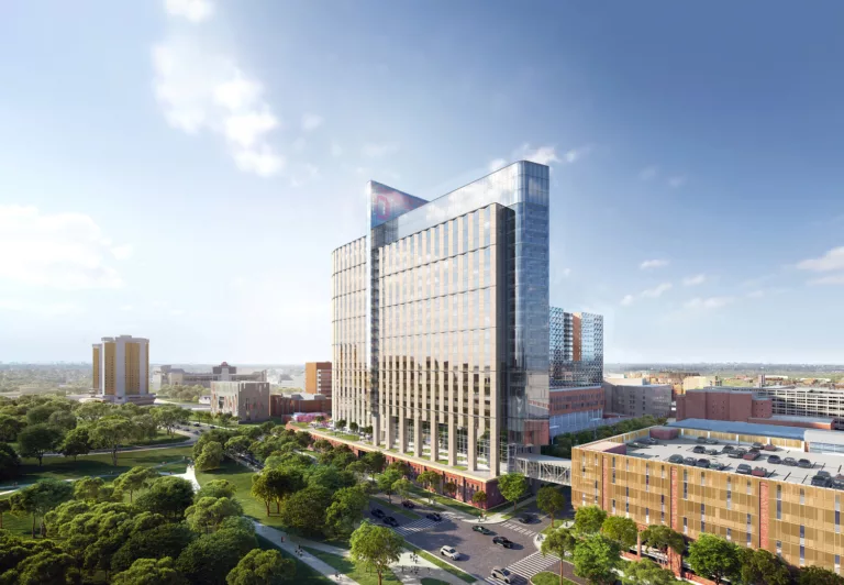 Aerial daylight rendering of the 26-story Ohio State University Wexner Medical Center Hospital with a pedestrian skybridge and landscaped public plaza