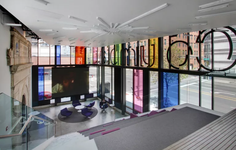 Interior daylight view overlooking the lounge at the Columbia College Media Production Center with a stepped seating area and intricate ceiling design