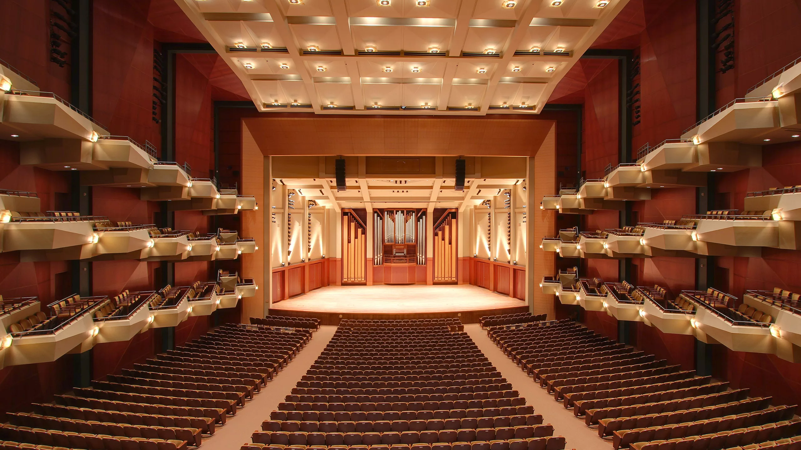 Interior view of Benaroya Hall's main hall, floor seating, balconies, and central stage