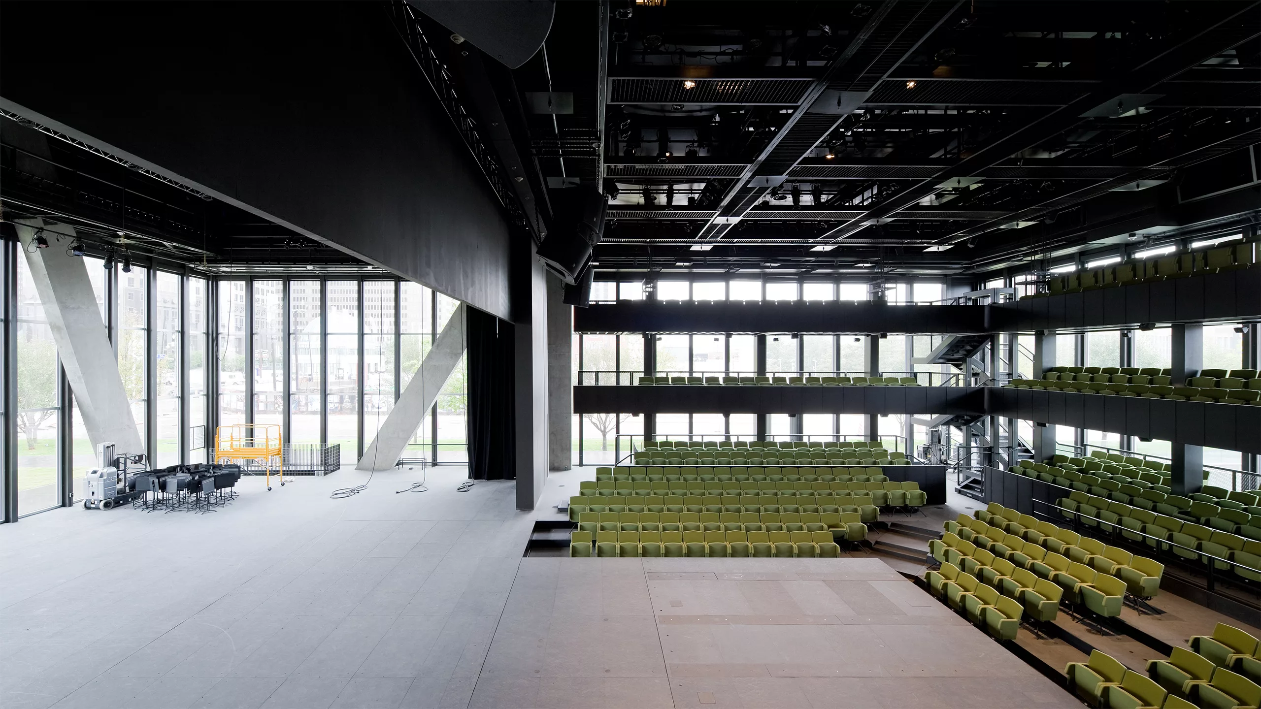 Interior view of the Dee and Charles Wyly Theatre's performance space with a three-level, L-shaped seating configuration