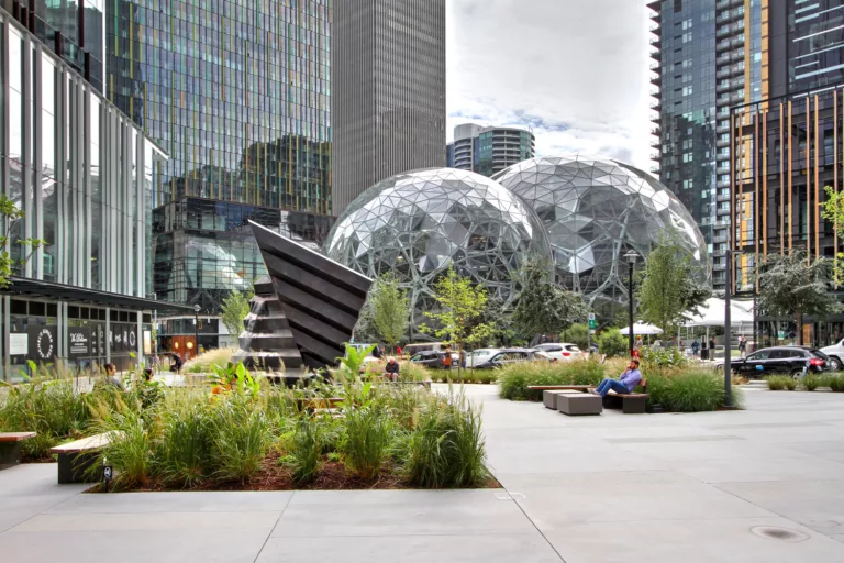 Exterior daylight view of Amazon in the Regrade’s public plaza with surrounding high-rise buildings