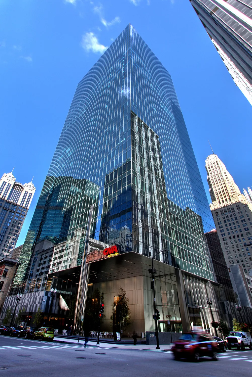 Exterior daylight view looking up at 151 North Franklin's 32-story facade with surrounding downtown Chicago high-rise buildings