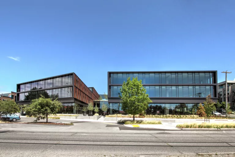 Exterior daylight view of the four-story NorthEdge office building and its central outdoor courtyard