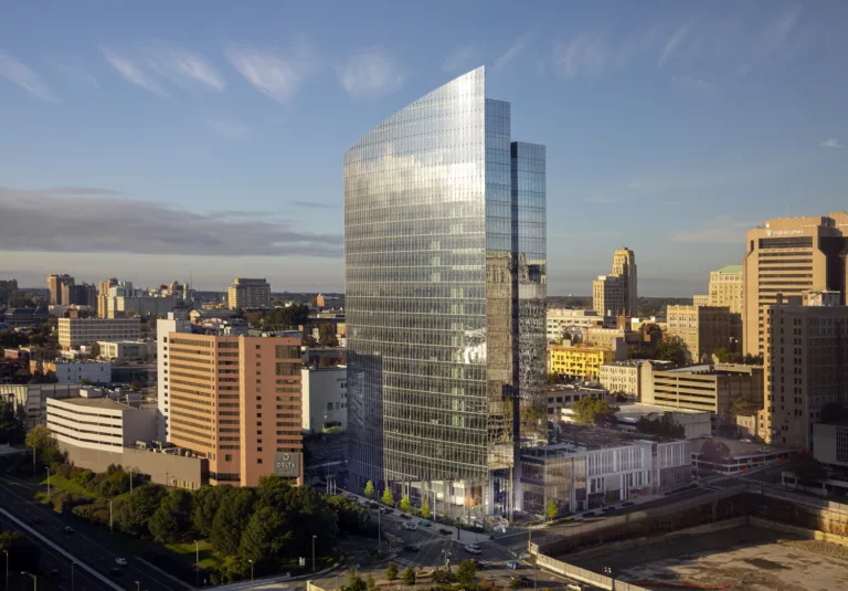 Aerial daylight view of the 20-story Dominion Headquarters Tower 1 with surrounding low-rise buildings