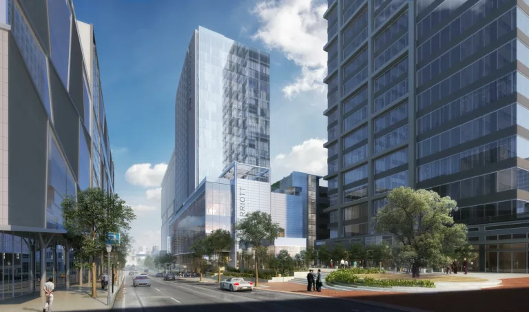 Exterior daylight rendering of the 22-story JW Marriott in downtown Charlotte with surrounding high-rise buildings and street-level traffic and sidewalk pedestrian activity
