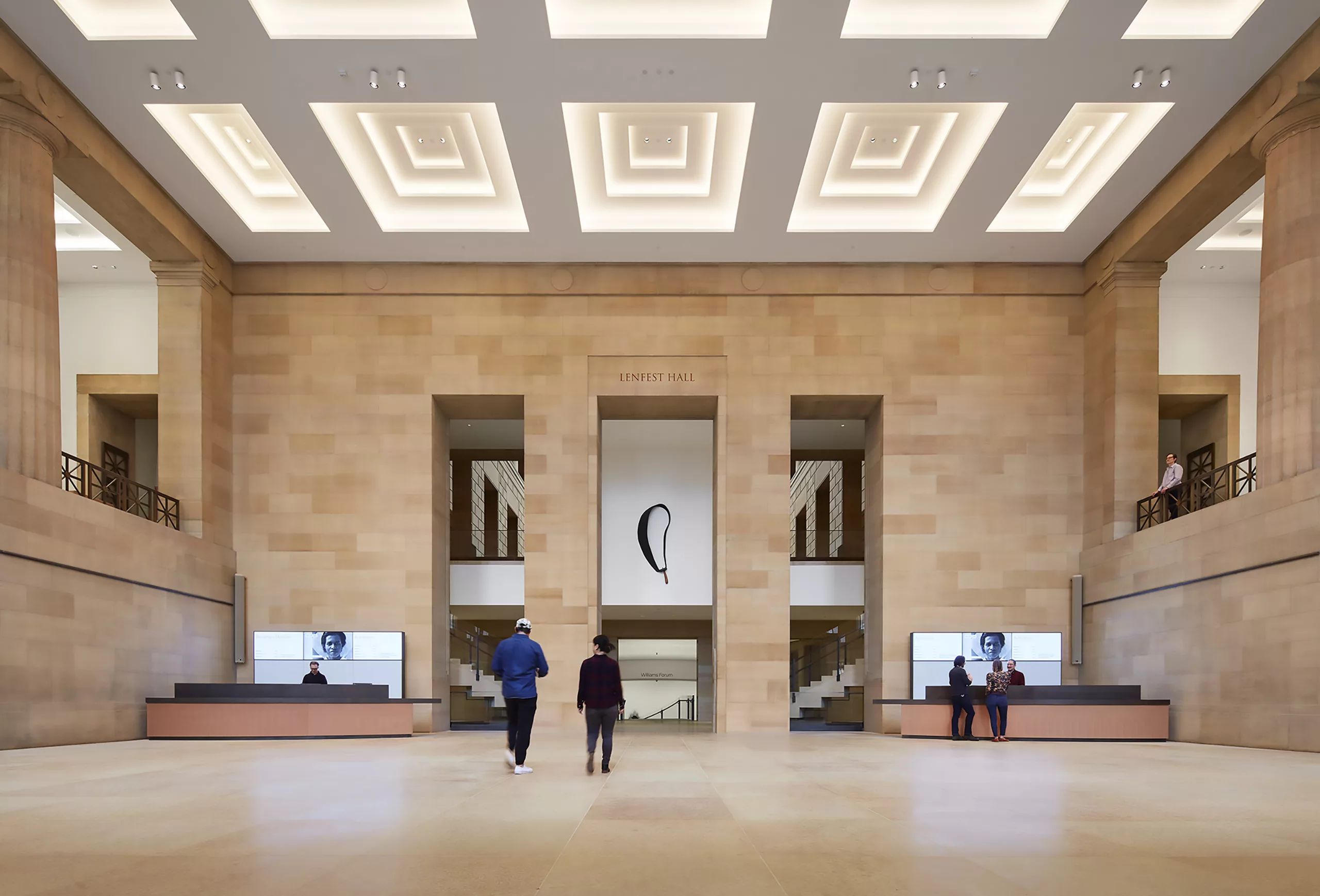 Philadelphia Museum of Art Expansion's Lenfest Hall interior with visitors and information desks
