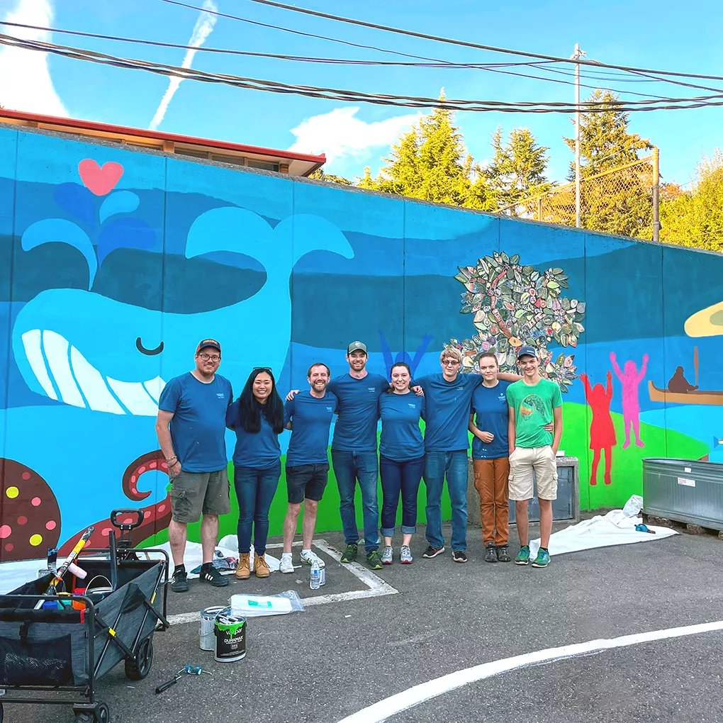 MKA Staff paint a mural at Graham Elementary School.